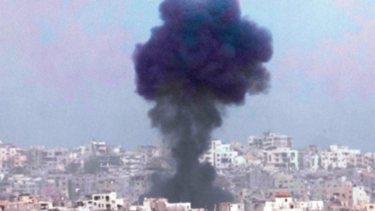 TOPSHOT - This picture taken from a position in southern Israel, on the border with the Gaza Strip, ...